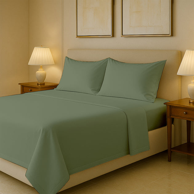 Luxury 400 thread count Egyptian cotton bed sheets neatly spread on queen size bed