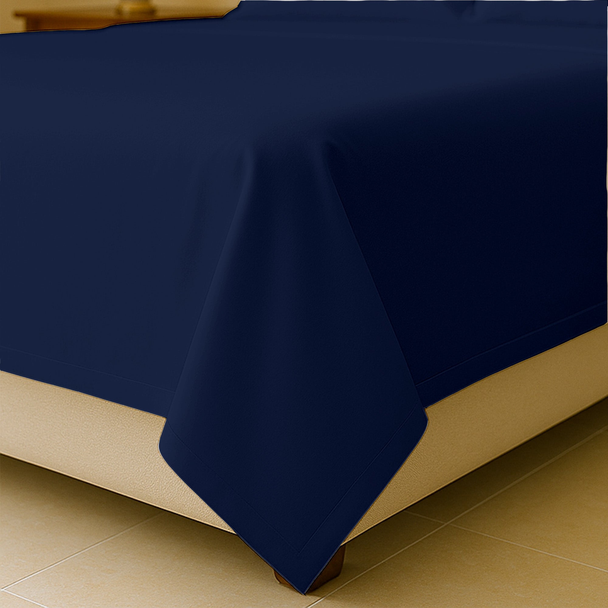 King size flat sheet spread across mattress