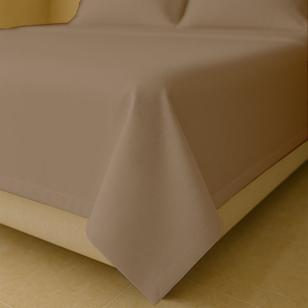 Luxury 400 thread count Egyptian cotton bed sheets neatly spread on queen size bed