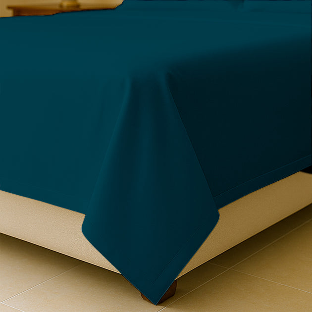 King size flat sheet spread across mattress
