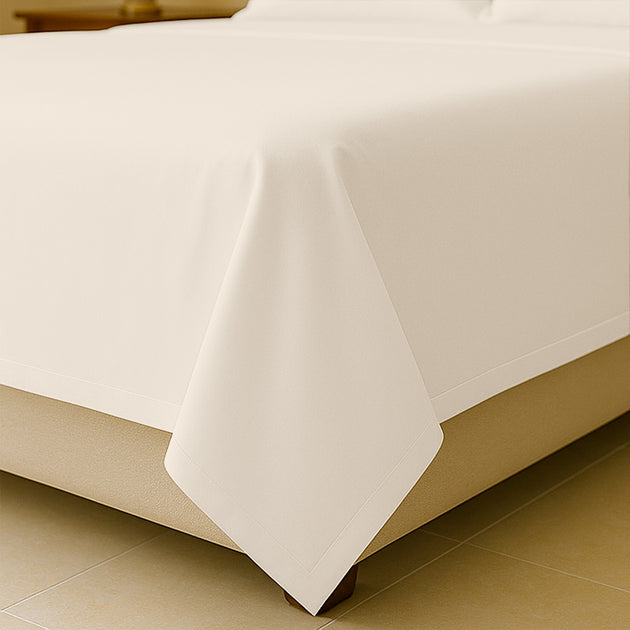  King size flat sheet spread across mattress