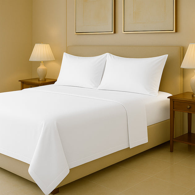 Luxury 1000 TC sheets in white cotton fabric displayed on king size bed